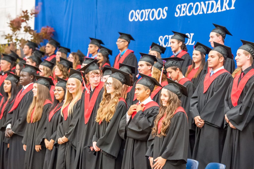 Members of the graduating class stand for the audience of parents, friends and relatives. (Richard McGuire photo)