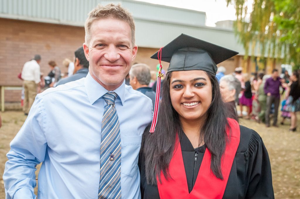 When teacher Peter Gajda (left) recently won the 2014 McEwen Family Teacher Recognition Award, he was asked to nominate a current high school student to receive a $5,000 scholarship to attend the University of British Columbia (UBC). At Thursday's award ceremony at graduation, the winner of that scholarship was announced -- Vriti Chawla (right). Chawla only learned she had been chosen when her name was called out at the ceremony. (Richard McGuire photo)