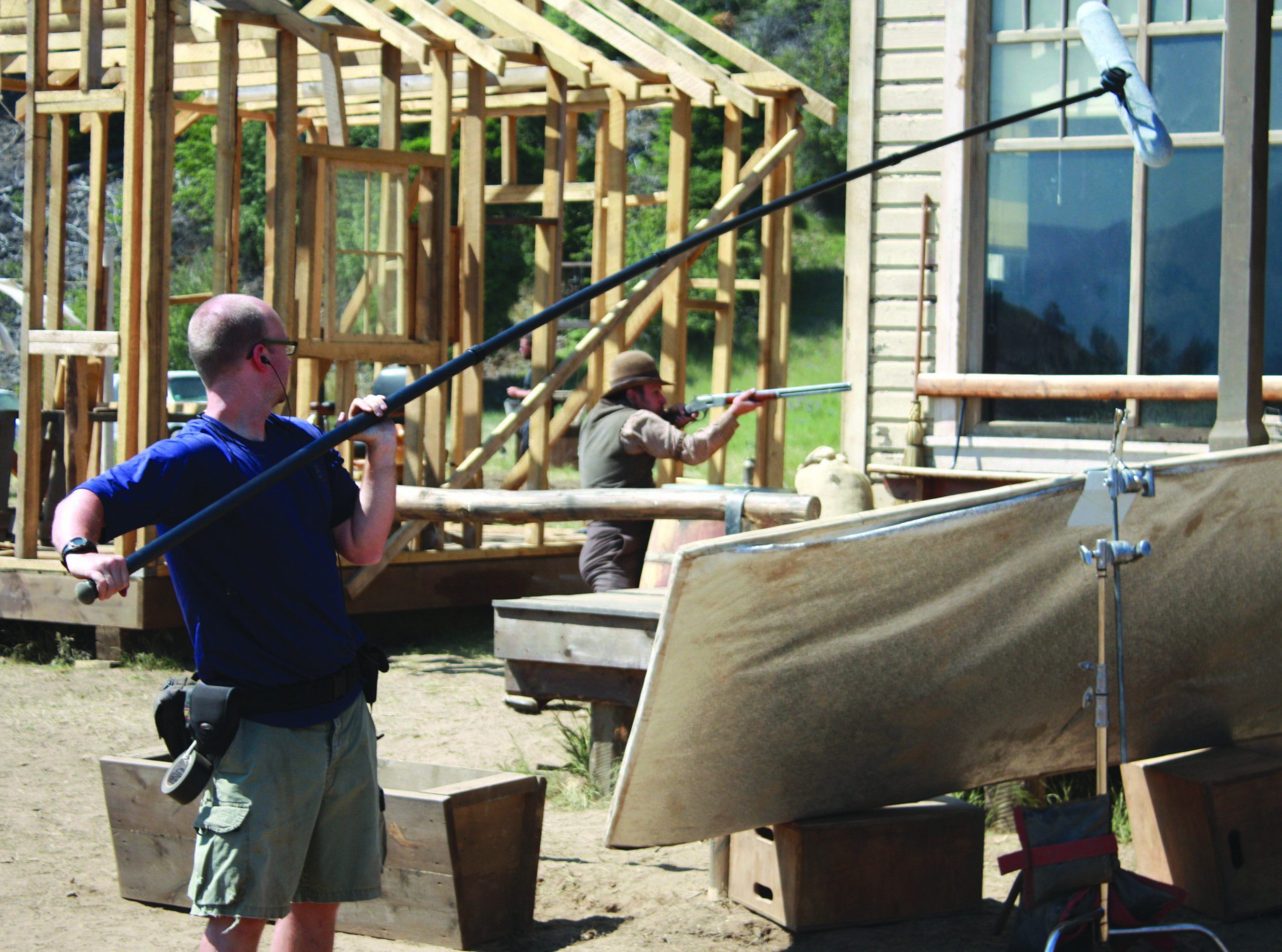 gunlessshootweb2 A boom microphone operator captures the sounds of a gun battle in the fictional town of Barclay’s Brush while Vancouver actor Jody Racicot fires a rifle nearby. The scene will be included in the film Gunless, which is currently filming in Osoyoos. Photo by Paul Everest