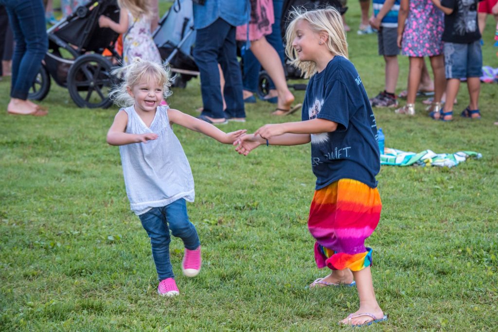 These girls were having fun dancing to the music of Lost Boys at last Wednesday's event to celebrate Phase 2 of the Gyro Park improvements. (Richard McGuire photo)