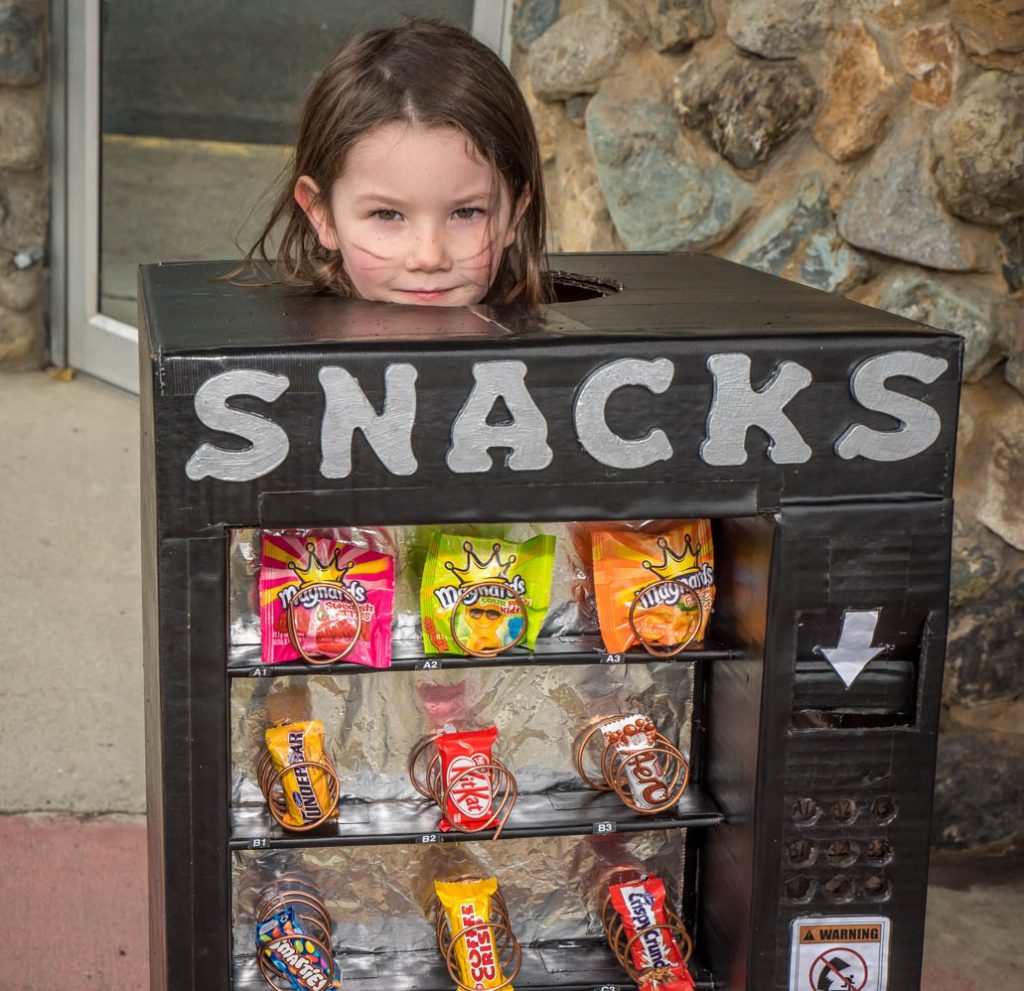 Alyra Mills, 5, went out as a vending machine at Trick or Treat Main Street in Osoyoos. The costume was her idea. (Richard McGuire photo)