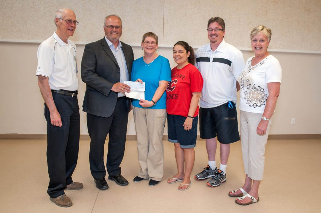 Osoyoos last week received its $25,000 prize for being nominated to the first round of Kraft Hockeyville. The money is for improvements to the Sun Bowl Arena. Making the presentation to the town was Chris Biagioni, in sales with Kraft, second from the left. Pictured from left are Councillor Michael Ryan, Biagioni, Theresa Ungar, who wrote the story nominating Osoyoos, Cathy Martins, who led the initiative, Gerald Davis, director of community services with the Town of Osoyoos and Councillor Sue McKortoff. Davis said the town is inviting input from the community about how best to use the money for the arena. Currently being considered are an improved sound system, an improved women's changing room or part of the cost of a new score clock. (Richard McGuire photo)