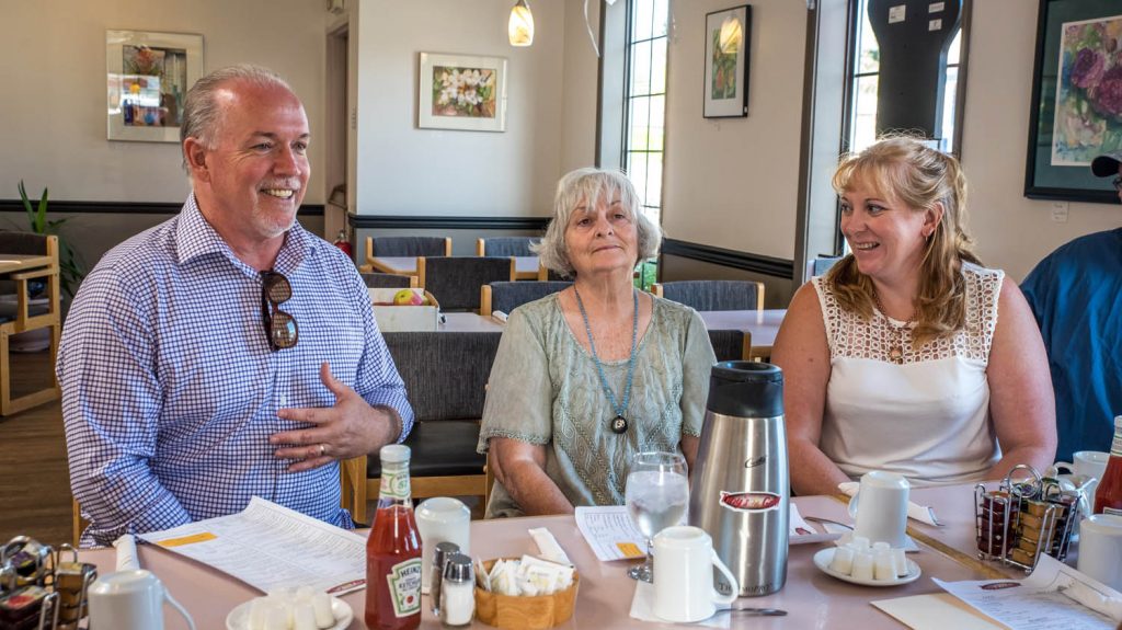 B.C. NDP Leader John Horgan shared a laugh at Troy's Grill in Osoyoos with Gaye Horn and Brenda Dorosz. (Richard McGuire photo)