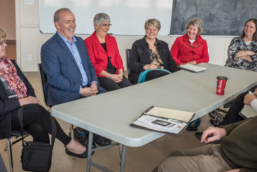 John Horgan, the leader of the B.C. NDP and official opposition, and Carole James, finance critic, were in Osoyoos last Wednesday as part of an outreach tour around the province. Horgan (second from left) and James (third from left) heard from a group of about 15 people about their concerns. The meeting at the Sonora Community Centre was not extensively promoted and Horgan said he prefers meeting with smaller numbers for a more intimate discussion. (Richard McGuire photo)