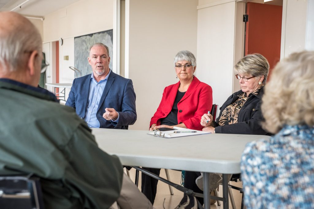 John Horgan, the leader of the B.C. NDP and official opposition, and Carole James, finance critic, were in Osoyoos last Wednesday as part of an outreach tour around the province. Horgan (second from left) and James (third from left) heard from a group of about 15 people about their concerns. The meeting at the Sonora Community Centre was not extensively promoted and Horgan said he prefers meeting with smaller numbers for a more intimate discussion. (Richard McGuire photo)