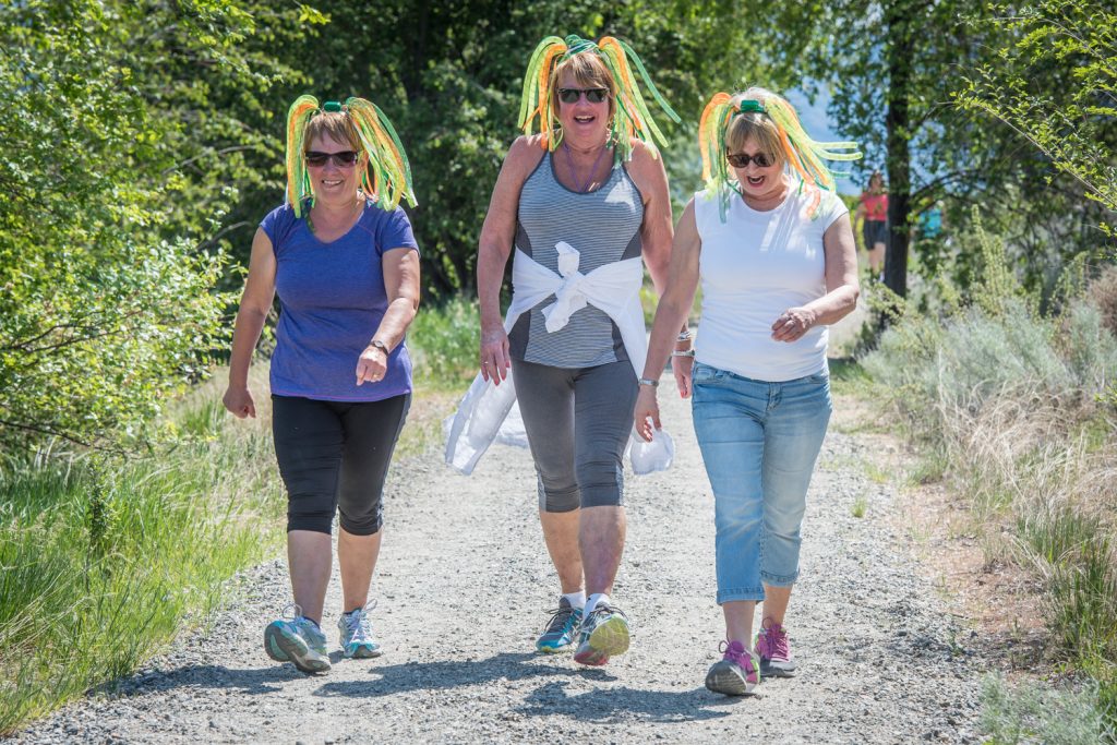 Walkers set out along the Irrigation Canal Walkway in Osoyoos for the Desert Hospice Society's Hike for Hospice on Sunday. Pictured here are walk organizers and hospice volunteers (from left) Delores Brisbois, Bonnie Svieson and Christine Yost. Yost is a director on the society's board. This is the first year that separate hikes have been held in Oliver and Osoyoos. The hike was to raise money for the organization that supports palliative and end of life care services. (Richard McGuire photo)