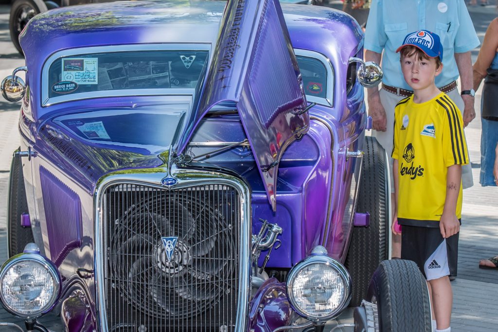 A boy admires a 1934 customized Ford. (Richard McGuire photo) 