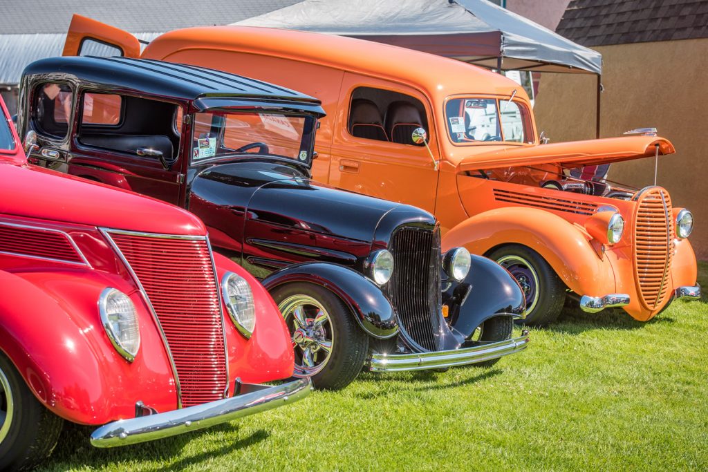 A trio of colourful classic vehicles brightens up Gyro Park. (Richard McGuire photo)
