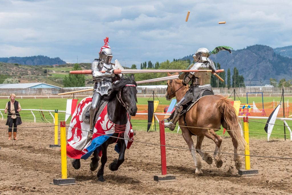 Stephane Tremblay (left) and Ripper Moore do battle with lances as they meet and lance fragments fly through the air. (Richard McGuire photo)