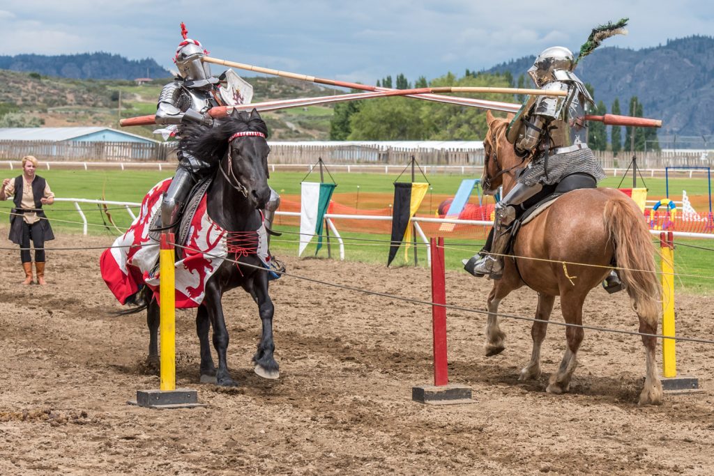 Stephane Tremblay (left) receives a lance in the face from opponent Ripper Moore. Although his face was well covered with armour, Tremblay was stunned and was checked over and helped to his feet by paramedics. (Richard McGuire photo)