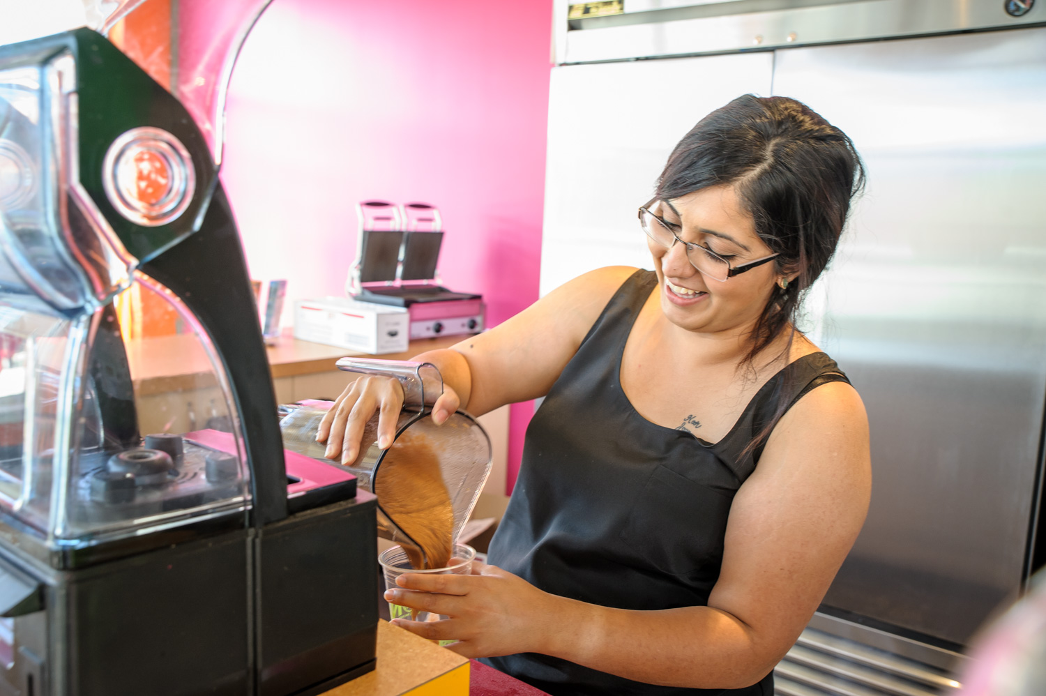 Nancy Bath, owner of JuiceBox Okanagan, prepares a juice creation for a customer. The restaurant offers more than 20 different kinds of smoothies and fresh juices as well as a small selection of paninis and wraps. JuiceBox Okanagan opened last week on the south side of the Watermark Beach Resort on Main Street in Osoyoos. (Richard McGuire photo)