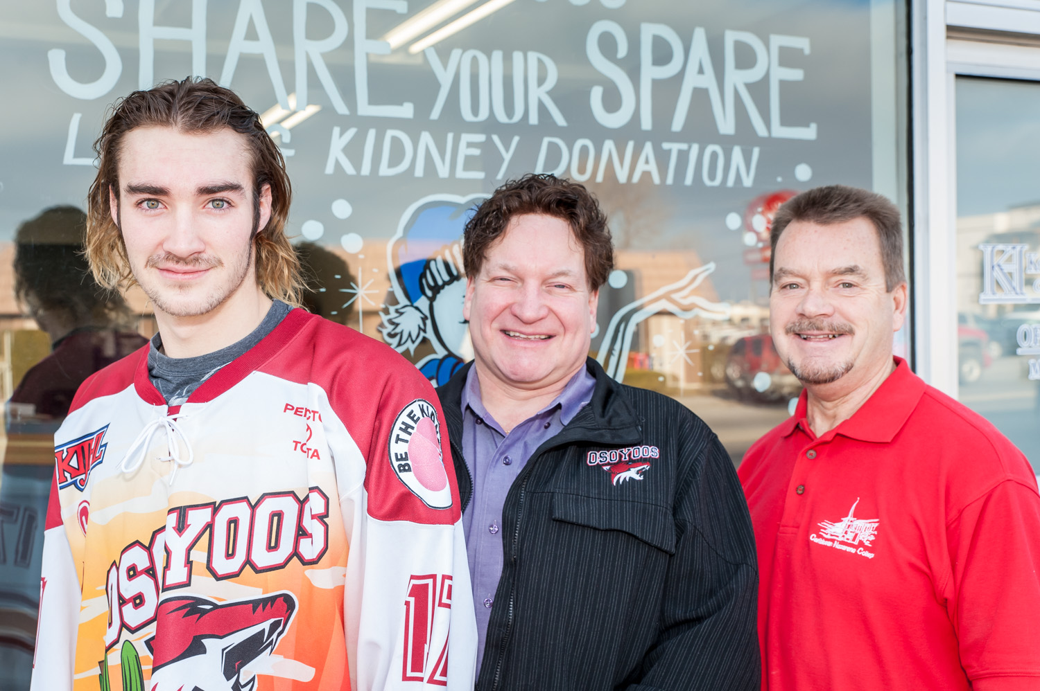 The Osoyoos Coyotes will be wearing patches on their jerseys to raise awareness about living kidney donation. The patches carry the slogan "Be the kidney." From left are Coyotes Captain Colin Chmelka, Coyotes owner Randy Bedard and Rotary Club of Osoyoos President Brian Rawlings, a member of Share Your Spare, who plans to donate a kidney. (Richard McGuire photo)