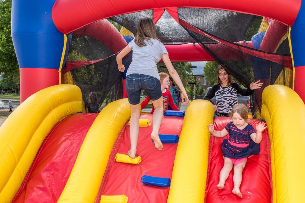Children play on the bouncy castle at Osoyoos Lake Appreciation Day at Gyro Park on Saturday. (Richard McGuire photo)