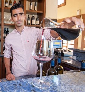 Mike Kosaka, operations manager at LaStella, pours a sample of Fortissimo, a red wine blend. (Richard McGuire photo)