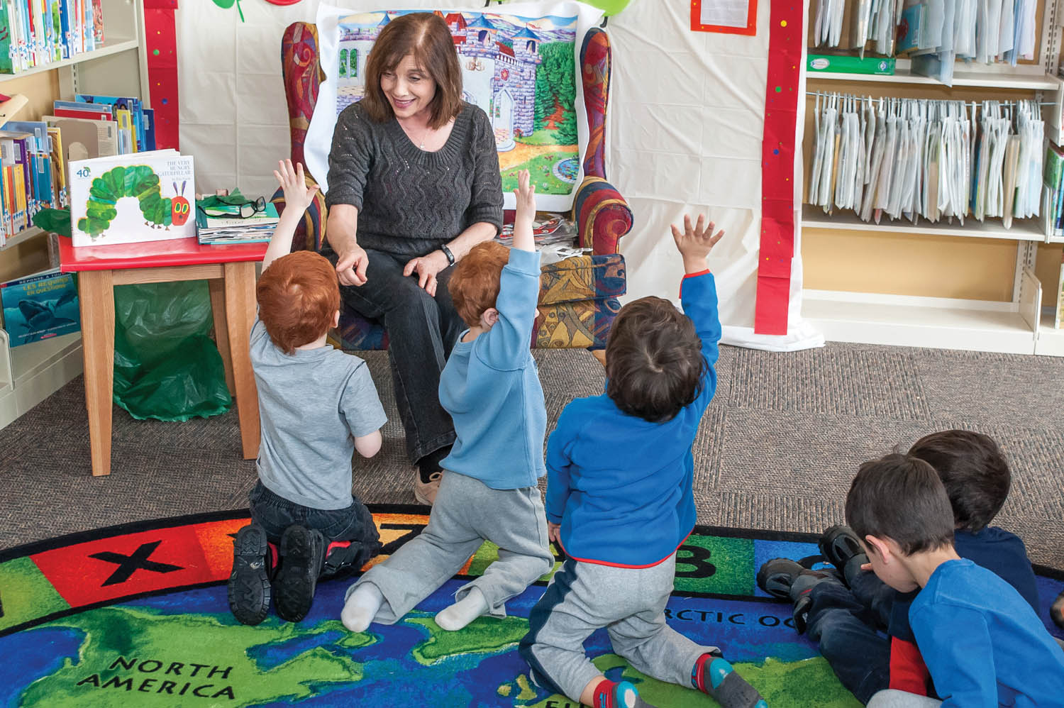 Librarian Diana Rawlings interacts with children at the Osoyoos Branch of Okanagan Regional Library in this storytime photo taken in February. The regional library is trying to balance resources between its library branches. (Richard McGuire file photo)