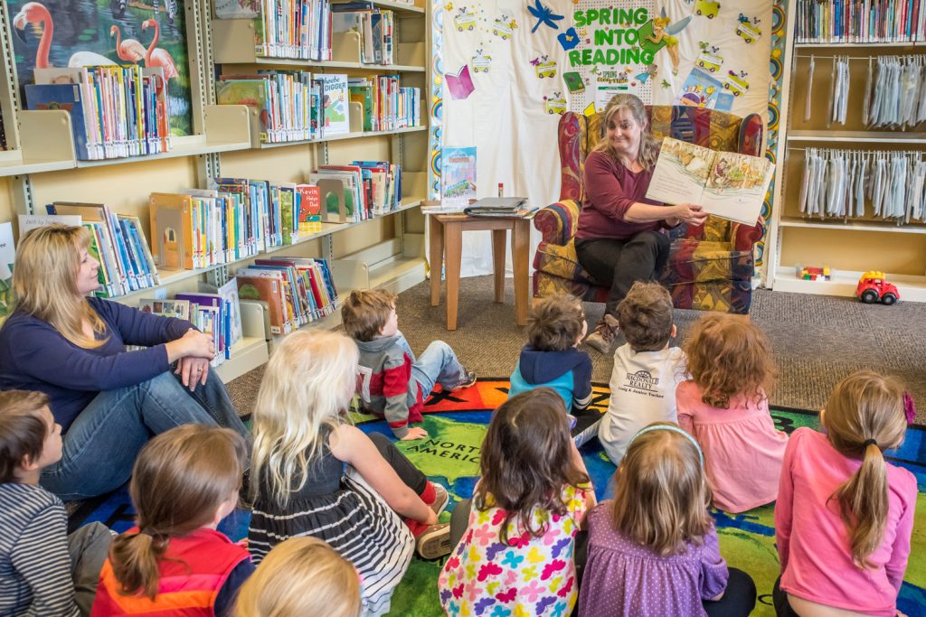 Georgia Bruyel, community librarian in Okanagan Falls, read to children last Thursday at the Osoyoos Branch of Okanagan Regional Library. She was filling in for regular reader Diana Rawlings. The library holds its Spring Storytime every Thursday at 10 a.m. for children aged three to five until May 7. The interactive sessions feature stories, puppets, crafts and songs. The library is located in the Sonora Community Centre. (Richard McGuire photo)