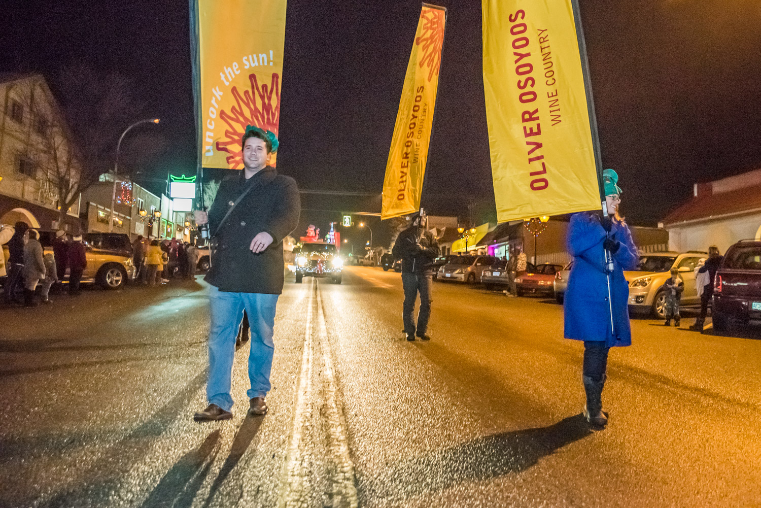 Marching in the parade with yellow banners were representatives of Oliver Osoyoos Wine Country. (Richard McGuire photo)
