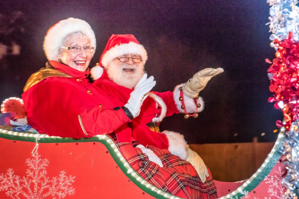 Santa and Mrs. Claus wave to spectators at the Santa Parade during Osoyoos Christmas Lite-Up. Mike and Margaret de Salaberry have played the role of the most popular Christmas couple over many years. (Richard McGuire photo)