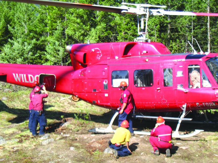 localfirefightersweb Ed Brouwer’s fire suppression team recently took a helicopter ride to a fire near Cawston, where they hand-dug a 1.5-kilometre fireguard to keep the lightning-caused fire from spreading. Photo submitted