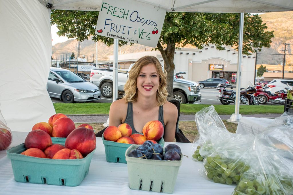 Taylor Pendergraft of Pendergraft Farms was selling fresh, ripe fruit at last Wednesday's Market on Main. This Wednesday will be the last Wednesday afternoon market of the season, but the Saturday markets continue well into September. Market on Main, as a true farmers' market, only allows local produce and locally made crafts to be sold. (Richard McGuire photo)