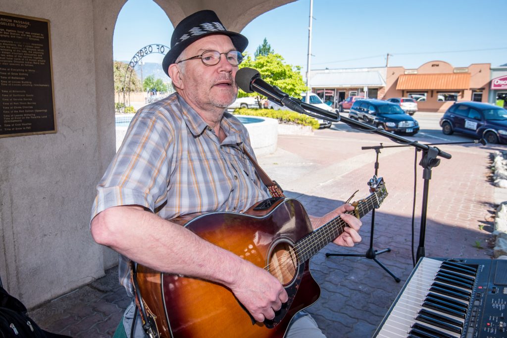 Market on Main opened for the season on Saturday. While it's too early from fresh fruit and vegetables, there were vendors selling crafts, preserves and other items. Pictured here Roland Berg entertained visitors with his musical repertoire. (Richard McGuire photo)