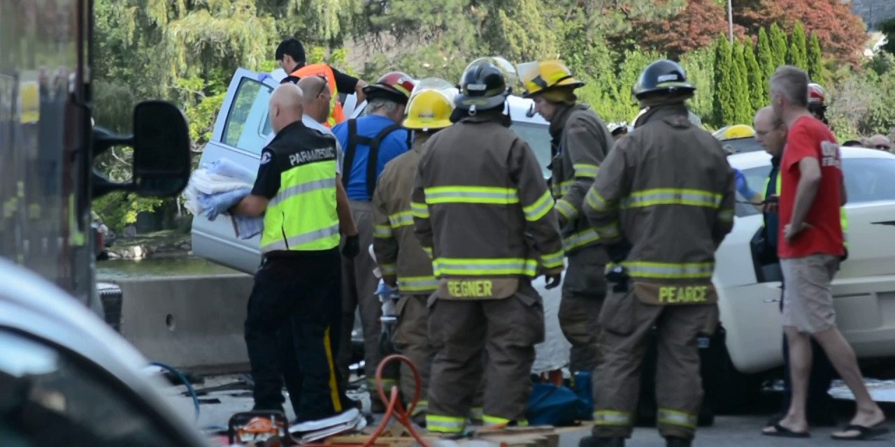 Two-vehicle collision traps occupants