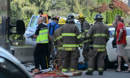 Two-vehicle collision traps occupants