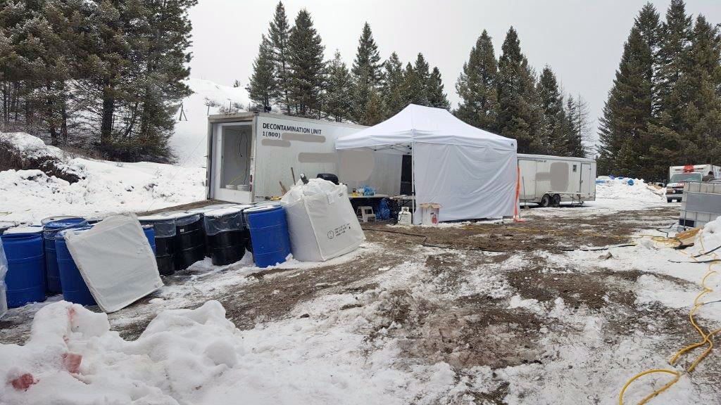Officials work to decontaminate a property between Bridesville and Rock Creek that is the site of a suspected methamphetamine lab. The property was the subject of a search warrant executed by the RCMP last Wednesday in which drugs and weapons were seized and two men were arrested. Interior Health is concerned about potential risks to nearby water supplies due to dumping of dangerous chemicals. (RCMP Photo)