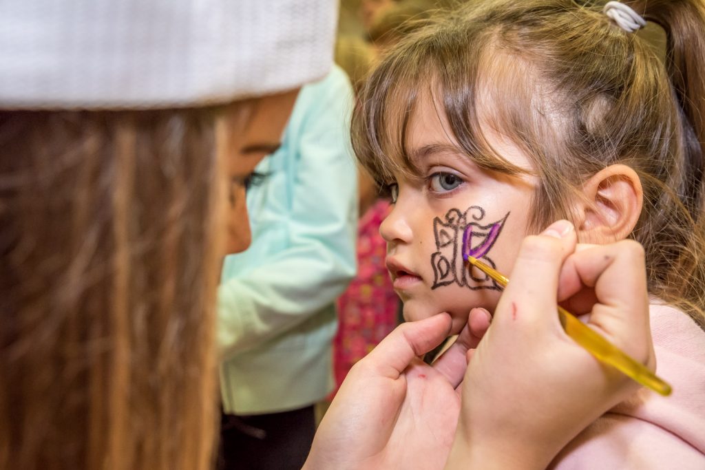 Emma Fernandes, 3, of Vancouver, got a butterfly painted on her cheek by Alyssa Macor. (Richard McGuire photo)