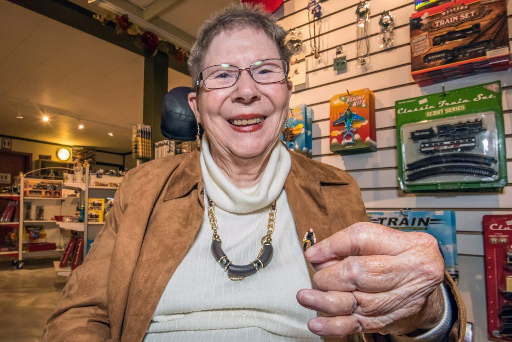 Ulla Pedersen shows one of the tiny Jon Montgomery figurines she hand painted for an episode of The Amazing Race Canada that was filmed in May at Osoyoos Desert Model Railroad. The show aired in early September. (Richard McGuire photo)
