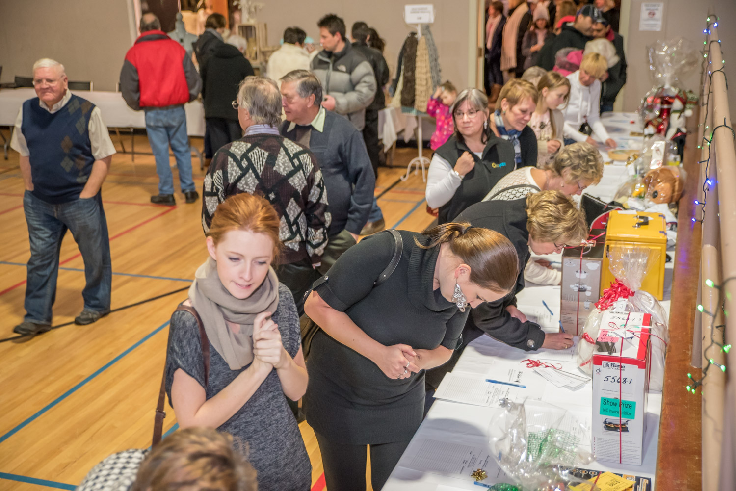 A silent auction was one of the major attractions at Santa's Night Out, a fundraiser for the Osoyoos Secondary School dry grad. (Richard McGuire photo)