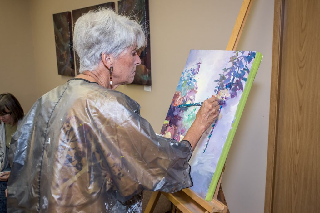 Keremeos artist Bonny Roberts was one of three local artists doing a "paint off" Friday at the official opening of the Okanagan Art Gallery in Osoyoos. The artists had just one hour to complete a painting, which was auctioned off afterwards. (Richard McGuire photo)