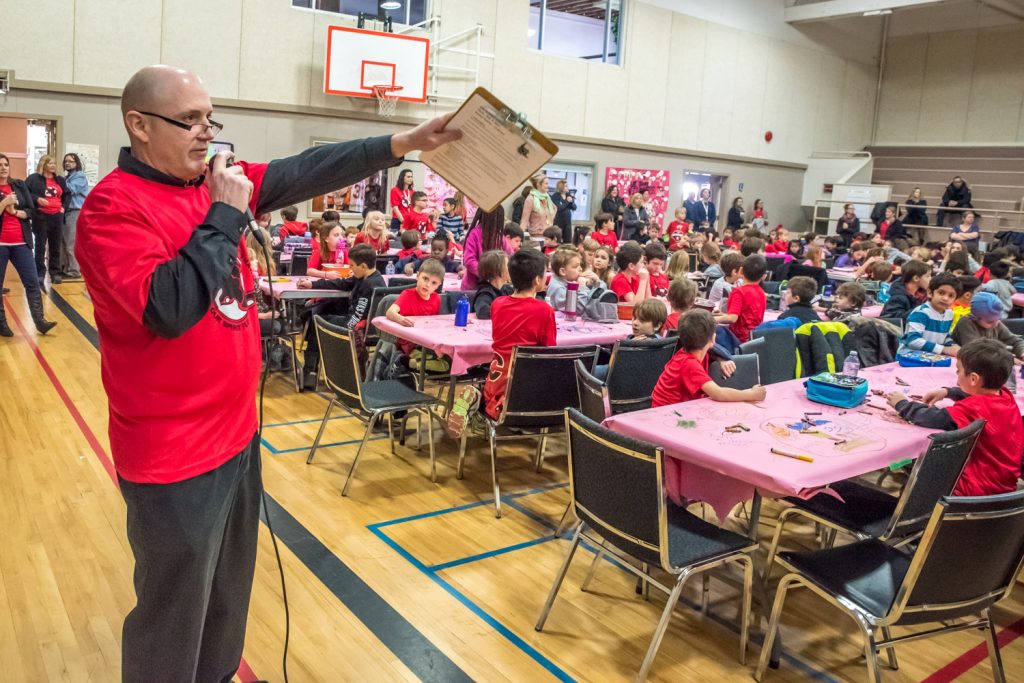 Principal Dave Foster addresses students during the final day of 21 Days of Kindness (Richard McGuire photo)