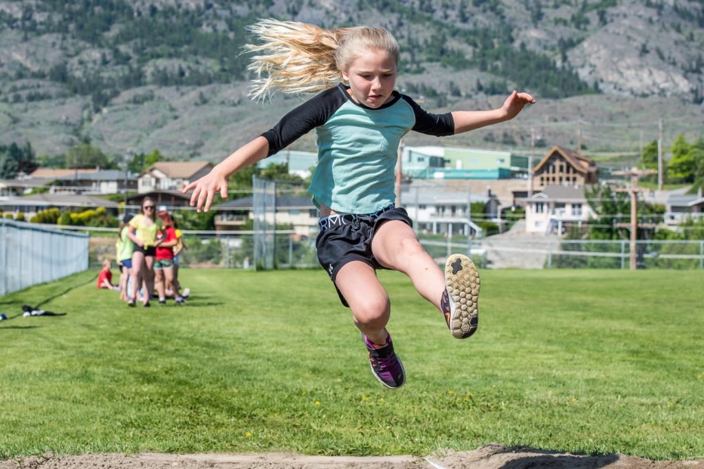 Paige Kaminski, a Grade 4 student at Osoyoos Elementary School, takes a flying leap in long jumping. The school's students had their track and field day Friday. (Richard McGuire photo)