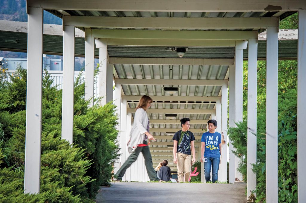 Students walk between classes at Osoyoos Secondary School in this file photo. School District 53 is again considering closing OSS and busing students to Oliver. (Richard McGuire file photo)