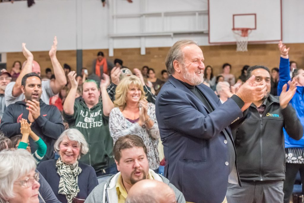 Members of the community, including former mayor Stu Wells (second from right), leapt to their feet to give strong applause to Brenda Dorosz, chair of the citizens' group Save Our Schools. (Richard McGuire photo)