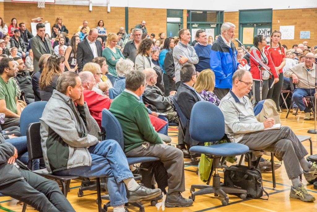 The school district hope to wrap up the meeting by 9 p.m., but shown here there were still many people lined up at the mic at 9:10 p.m. The meeting didn't end until nearly 10:30 p.m. as more and more people kept stepping up when the line-up got shorter. (Richard McGuire photo)