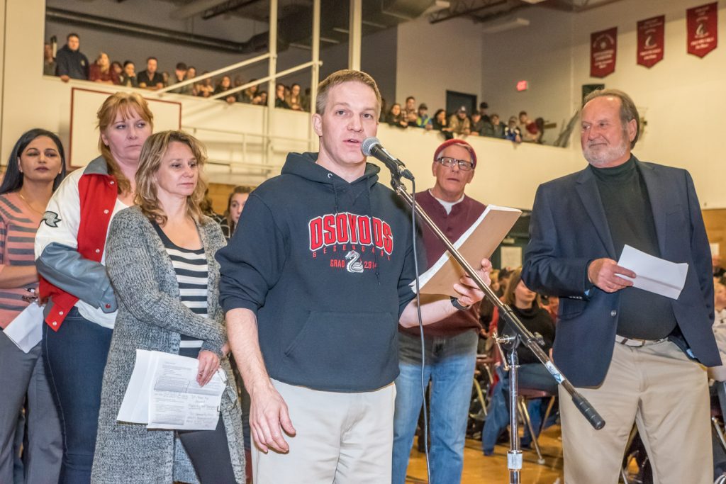 Second to speak after Mayor Sue McKortoff was OSS teacher Peter Gajda. Also waiting a chance to speak (from left) are Kuldeep Rai, Brenda Dorosz, Michelle Nehring, David Smith and former Osoyoos mayor Stu Wells. (Richard McGuire photo)