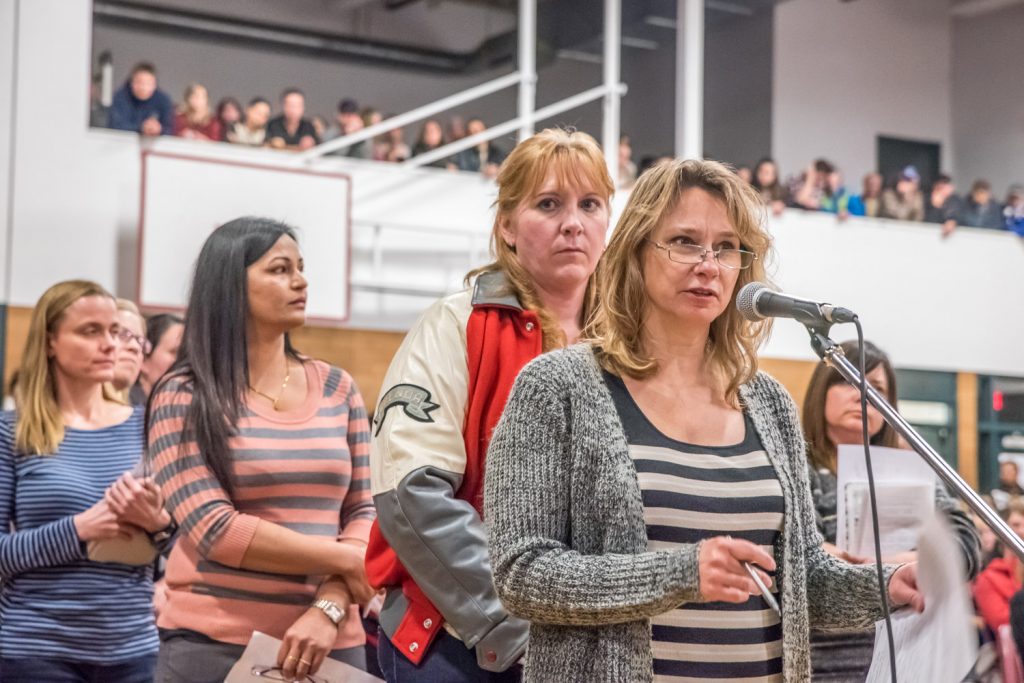 Michelle Nehring, president of the OSS parent advisory council, tells trustees about the impact the school closing would have on students. Behind her, waiting for their turn to speak (from left) are Robin Stille, Kuldeep Rai and Brenda Dorosz. (Richard McGuire photo)