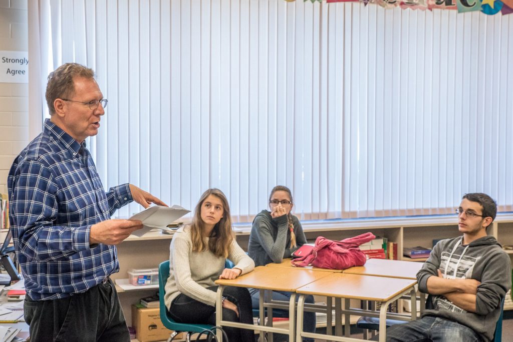 Richard McGuire, reporter/photographer with the Osoyoos Times, spoke to Grade 12 English students at Osoyoos Secondary School last week. The students in Catherine Scott's class are working on a newspaper to go along with the mock election the school is holding and McGuire gave them some tips about different news styles and election coverage. He talked about the differences between straight news stories, features, editorials and opinion columns. He also discussed some of the stories the students plan to write about and asked their thoughts on the election campaign. Several students had thoughts on the election, while others said they skip or mute the attack ads on TV. (Catherine Scott photo)