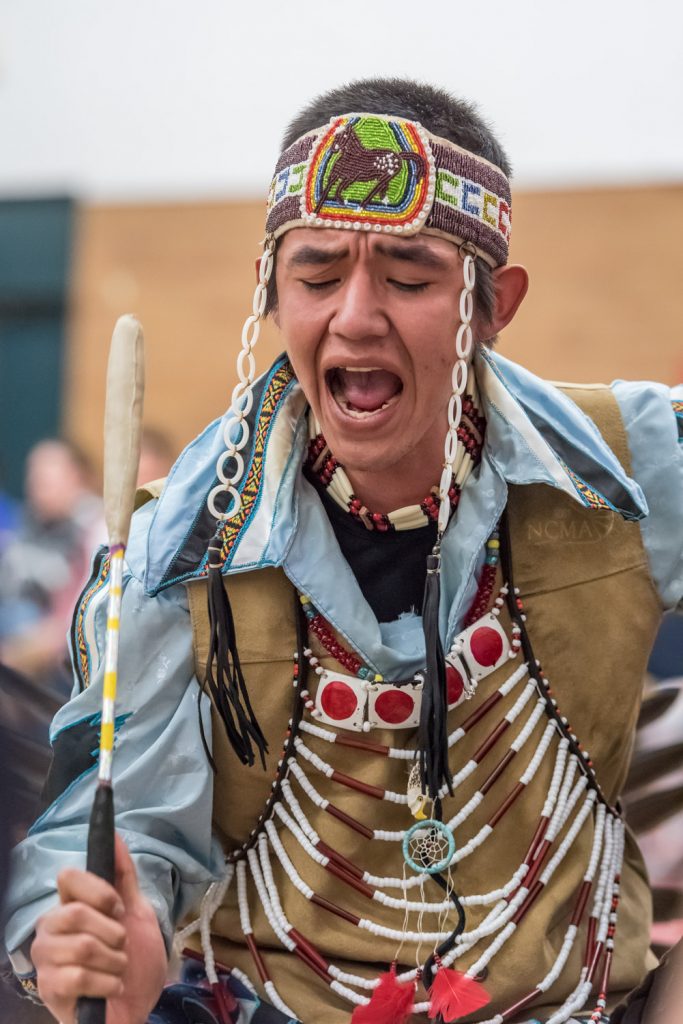 Emery Robins Jr. beats a drum during the "Celebration of Traditions" traditional pow wow held at Osoyoos Secondary School on Friday and Saturday. The pow wow, hosted by School District 53's Aboriginal Education Council, rotates each year between the high schools in the district. Robins is from Vernon. (Richard McGuire photo)