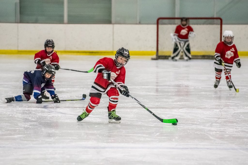 Jaxson Bartsch of the South Okanagan Red Dragons advances with the puck from his end in the Hockey Wars Pre-Novice Tournament at the Oliver Arena on Saturday. In this game the local team faced the West Kelowna Sharks. Six teams participated in the tournament that included children as young as four. (Richard McGuire photo)
