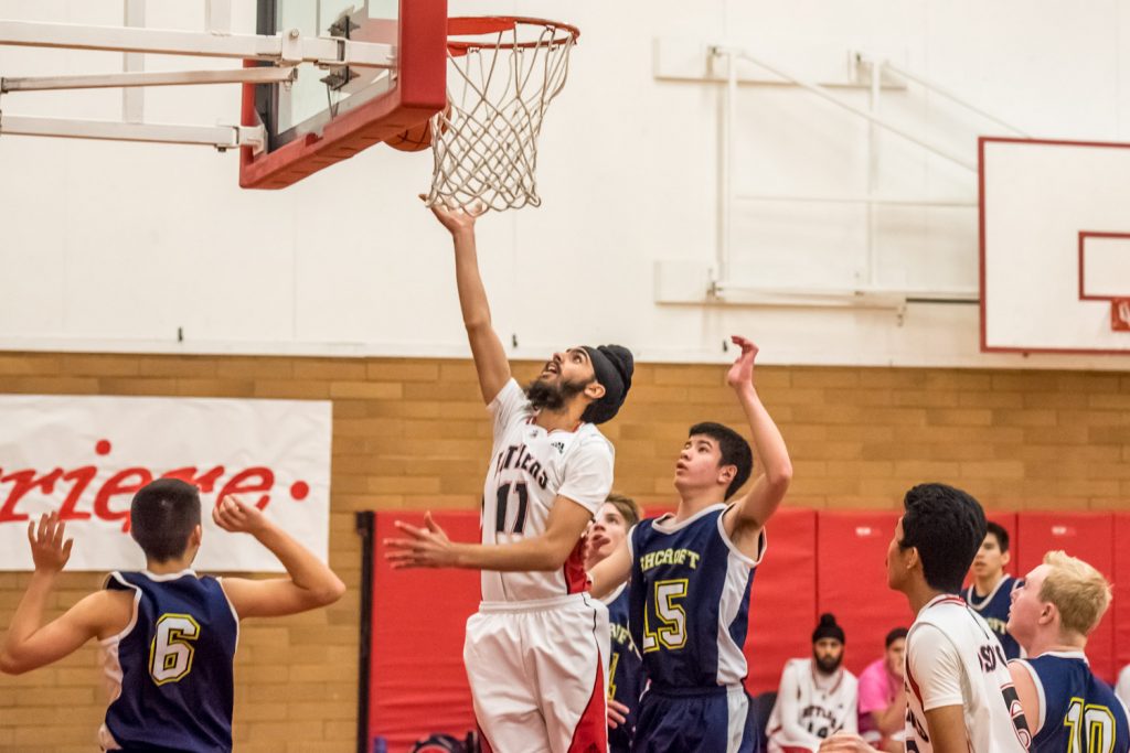Kavneer Dhaliwal of the Osoyoos Rattlers leaps to score two points against Ashcroft in the opening game of the Valleys Tourament on Thursday. (Richard McGuire photo)
