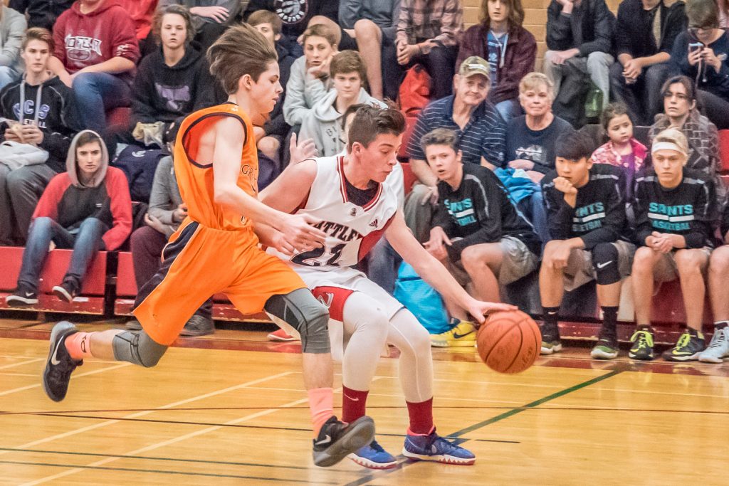 Justin Davis advances with the ball for the Rattlers as the Osoyoos Secondary School's senior boys basketball team came back from behind to beat Aberdeen Hall Preparatory School 73-66 Friday. This was the Rattlers' opening game in the two-day Desert Classic tournament. (Richard McGuire photo)