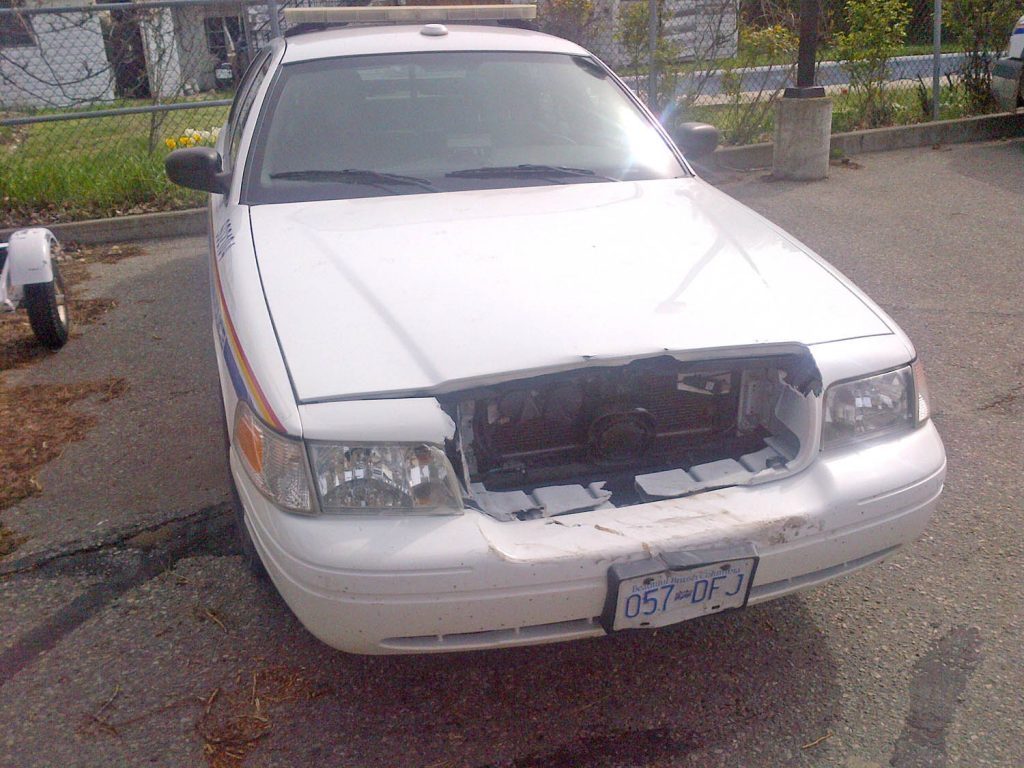 This Osoyoos RCMP vehicle received front-end damage when a suspect shifted a stolen 1994 Toyota Camry into reverse, ramming the police car. The suspect was later apprehended in Oliver after Oliver RCMP deployed a spike belt. (Osoyoos RCMP photo)