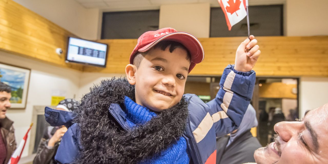 More than 30 give emotional welcome to Syrian family