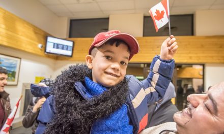 More than 30 give emotional welcome to Syrian family