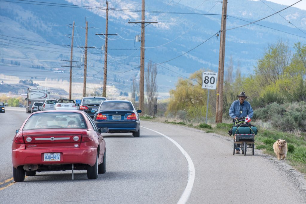 Robin Edgar Haworth is walking from Penticton to Ottawa with his dog Koda to raise awareness about a number of "wrongs and injustices" that concern him. He walked down Highway 97 to Osoyoos on Saturday before heading off east up Anarchist Mountain. His campaign is called Right the Wrong. (Richard McGuire photo)