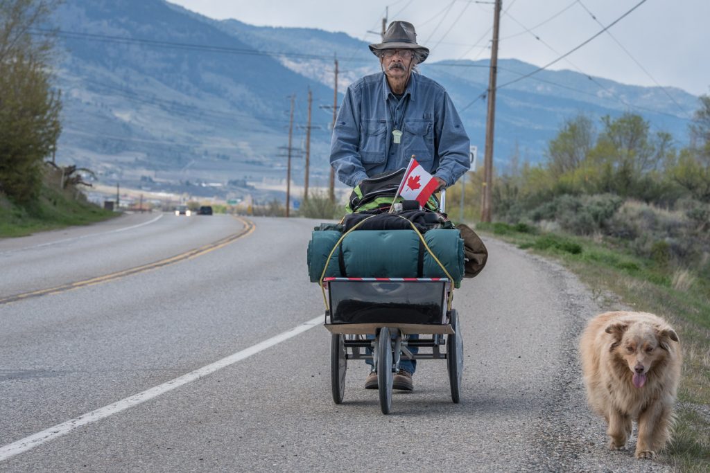 Robin Edgar Haworth is walking from Penticton to Ottawa with Australian Shepherd dog Koda to raise awareness about a number of "wrongs and injustices" that concern him. He walked down Highway 97 to Osoyoos on Saturday before heading off east up Anarchist Mountain. His campaign is called Right the Wrong. (Richard McGuire photo)