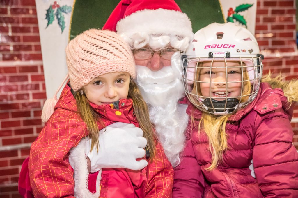 Bella Cassini and Makenzie Lockerby, both six, had a chance to meet Santa Claus during Rockin’ With Santa, a town-organized free family skate at the Sun Bowl Arena on Saturday. Many families and youngsters turned out to skate, meet Santa and enjoy games, refreshments and turkey draws. (Richard McGuire photo)
